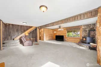 Large family room is centrally located in the heart of the home- a warm free standing stove will help keep cost low in the winter months.