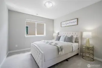 Bedroom 2: Beige queen size bed displayed and still has ample space