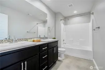 Hall way bath w shower tub combo and double vanity