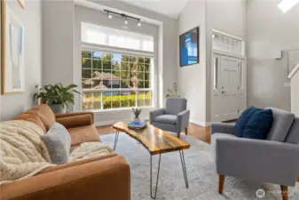Soaring ceilings and beautiful picture window in the Living Room