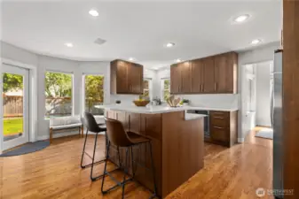 Tasteful updates in the kitchen include new cabinetry, quart counters and subway tile backsplash.