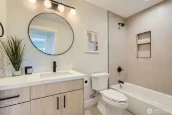 Full bath with tub/shower combo.