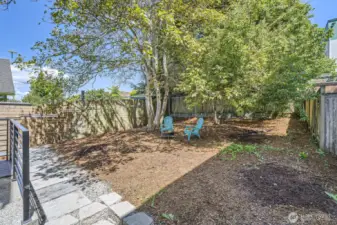The backyard is fully fenced for added privacy.