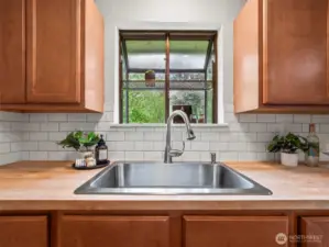 The kitchen sink was replaced with the counter tops and you have a great view overlooking the large back yard.