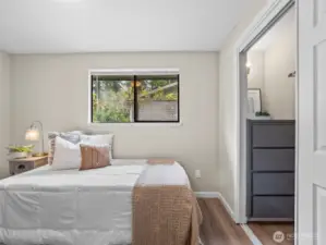 The large walk in closet in this bedroom as features a built in dresser you can see in the photo.