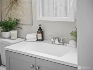 The bathroom features a new vanity and full size tub and shower.
