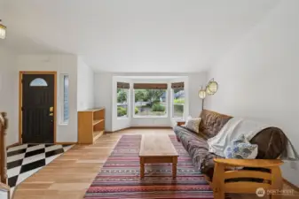 Formal living room with cathedral ceilings