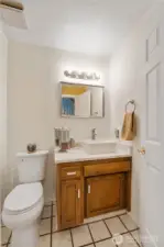 The convenient 1/2 bath downstairs has been beautifully refreshed with modern updates, including a new toilet, stylish new countertop and a sleek vessel sink that adds a touch of contemporary charm!
