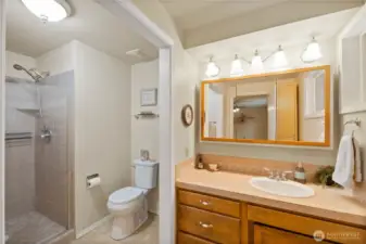 The Primary bath has a beautiful tiled walk-in shower, and a new toilet.
