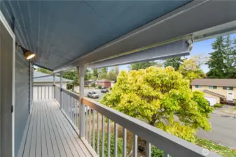 Enjoy the charm of this expansive of this upper porch that spans the front of the house, and is accessible from both of the front bedrooms.  Sip your morning coffee and take in the neighborhood views.  And it would be a great space for your seasonal decor!