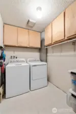 The Laundry offers lots of storage options with a plethora of cupboards.  You'll also pass through here to access the garage and basement area.  Washer & Dryer DO NOT CONVEY