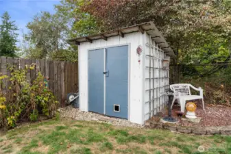 This shed offers a great placee to store your outdoor tools or winterize your plants.