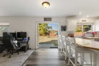 Open concept living extends outside via french doors