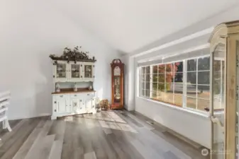 this front room could serve as a library, coffee lounge or sitting area