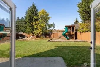 French doors open to the big back yard