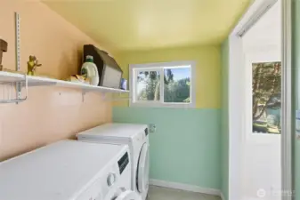 Laundry room, with space for additional storage.