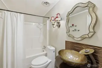 Full bath in hallway.