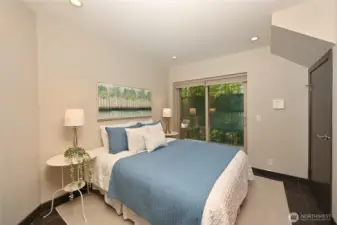 This bedroom also has sliding doors to a private patio.