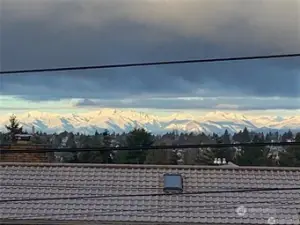 This picture was taken from the house in front on a mountain day. The view from here is similar, without the wires.