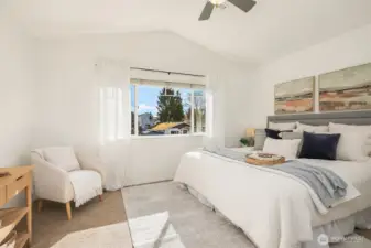 Vaulted ceilings in this gorgeous primary bedroom.