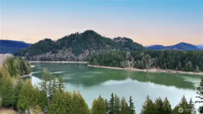 A sweeping aerial view of stunning Alder Lake with it's distinctive turquoise water surrounded by the Tatoosh Range.