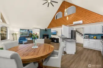 The modern updates paired with the open-concept main floor provides functionality, flow while still allowing a warm and cozy cabin-style vibe. Vaulted ceilings and updated Luxury Vinyl Plank flooring throughout, plus a mini-split and electric fireplace ensure comfort in any season.