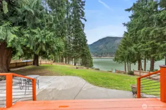 Step out on to the deck with expansive views of Alder Lake and surrounding grounds and forest. Resident eagles and hummingbirds fly around you, as deer pass through  the yard.