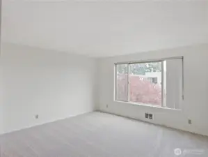 Spacious primary bedroom. Located at the back side of building for quiet nights.