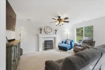 Family room just off the kitchen with gas fireplace.