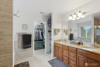 Primary 5-fixture bath with large walk-in closet.