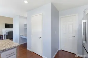A little desk area and pantry in the kitchen.  The door to the right leads you into the laundry room and then the garage.