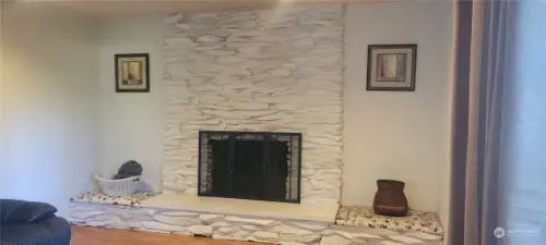 Gorgeous Stone Mantel fireplace in formal living room