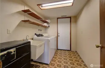 laundry room with door to back yard