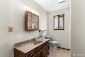 Upper bathroom with tub and shower