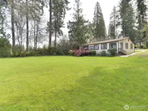 Unique lakefront property, two houses, shop, toolshed, garage.  Over .75 acre
