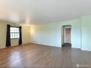 Main floor living room.  New floor, marble entry, new windows