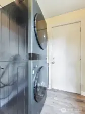 Big laundry room has new floor.  LG laundry center stays