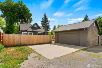 Garage off alley with El car charger.
