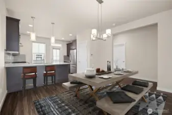 Looking at the dining room with the kitchen beyond.