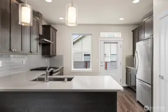 Looking toward the door that leads to the back deck which is almost the width of the home.