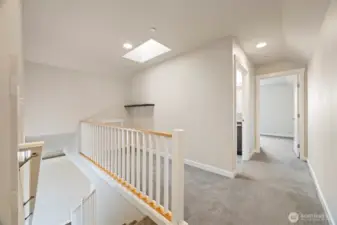 Looking at the landing of the stairway which could be an office, studio or a play area. Great natural light with the skylight above.
