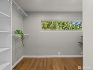 Enormous primary bedroom walk in closet