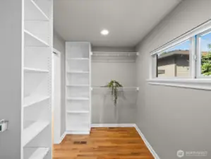 Another view of primary bedroom walk in closet