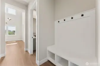 Functional drop zone with built-in bench, cubbies, and coat hooks—perfect for organizing shoes, backpacks, and jackets near the entry.