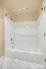 Bathroom with tiled walls and floors