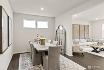 Formal dining room for entertaining. Photo is representational. Actual home is under construction. Colors, materials, and features may vary. See site agent for details.