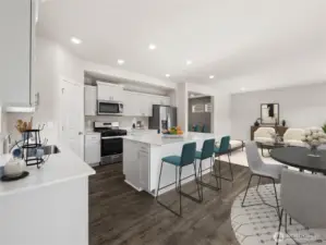 Large open concept living area. Photo is representational. Actual home is under construction. Colors, materials, and features may vary. See site agent for details.