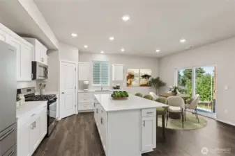 Stainless-steel appliances and shaker style cabinets with soft close doors. Photo is representational. Actual home is under construction. Colors, materials, and features may vary. See site agent for details.