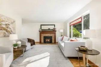Step inside to sunny living room w/ Jotul woodstove to keep you cozy all winter. Custom marble face & mantel centers you while you relax