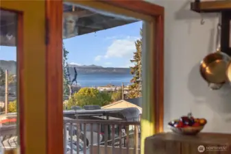 With a door leading to an expansive covered deck,  al fresco dining with a view can be a year round event.